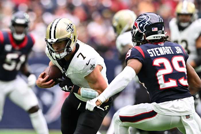 New Orleans Saints quarterback Taysom Hill (7) runs the ball as Houston Texans safety M.J. Stewart (29) defends during the second quarter at NRG Stadium.